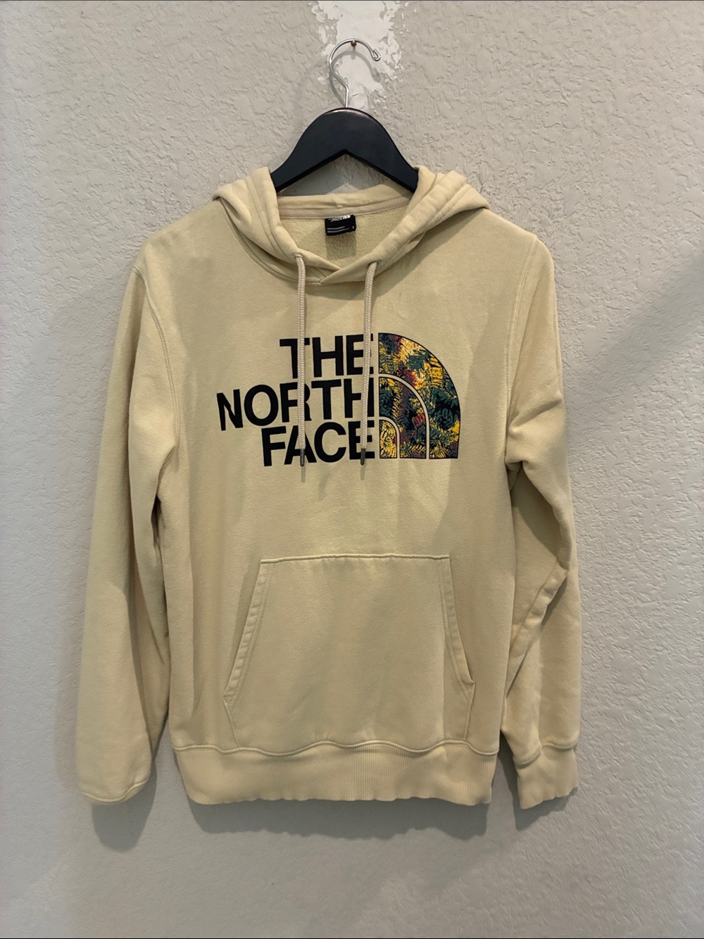 The North Face Cream Hoodie with Multicolor Pattern Logo